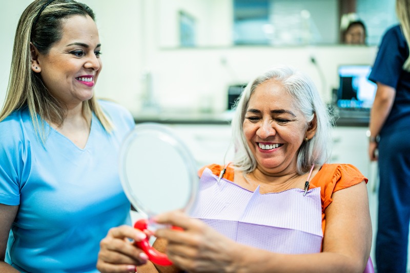 Old lady happy after getting dental sealants for her sensitive teeth in Norton Shores, MI